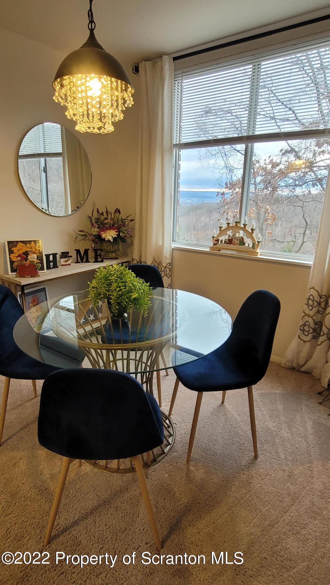 1506 Summit Pointe Scranton, PA 18508 - Photo 11 of 21 a view of a dining room with furniture window and outside view