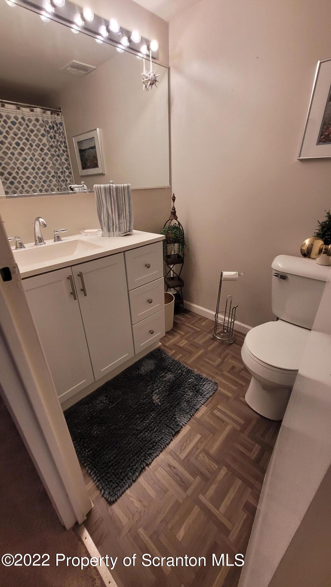 1506 Summit Pointe Scranton, PA 18508 - Photo 16 of 21 a bathroom with a sink and a toilet