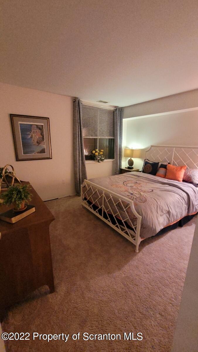 1506 Summit Pointe Scranton, PA 18508 - Photo 17 of 21 a bedroom with bed and window
