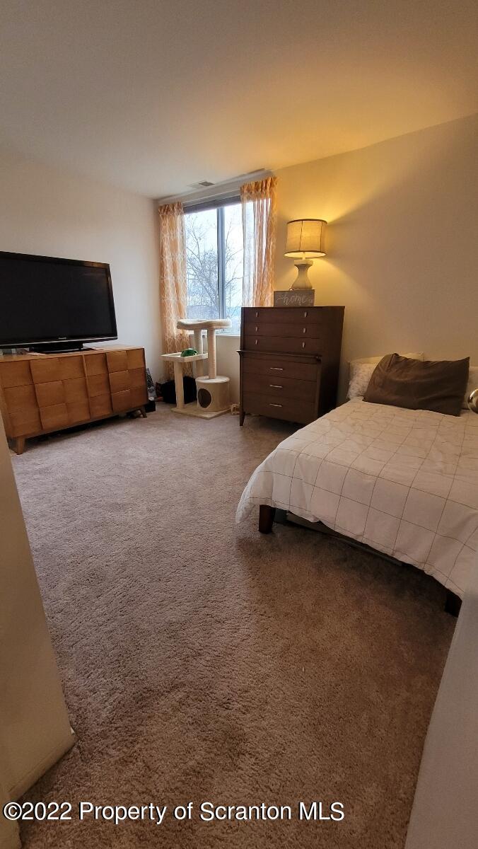 1506 Summit Pointe Scranton, PA 18508 - Photo 18 of 21 a bedroom with a bed and window