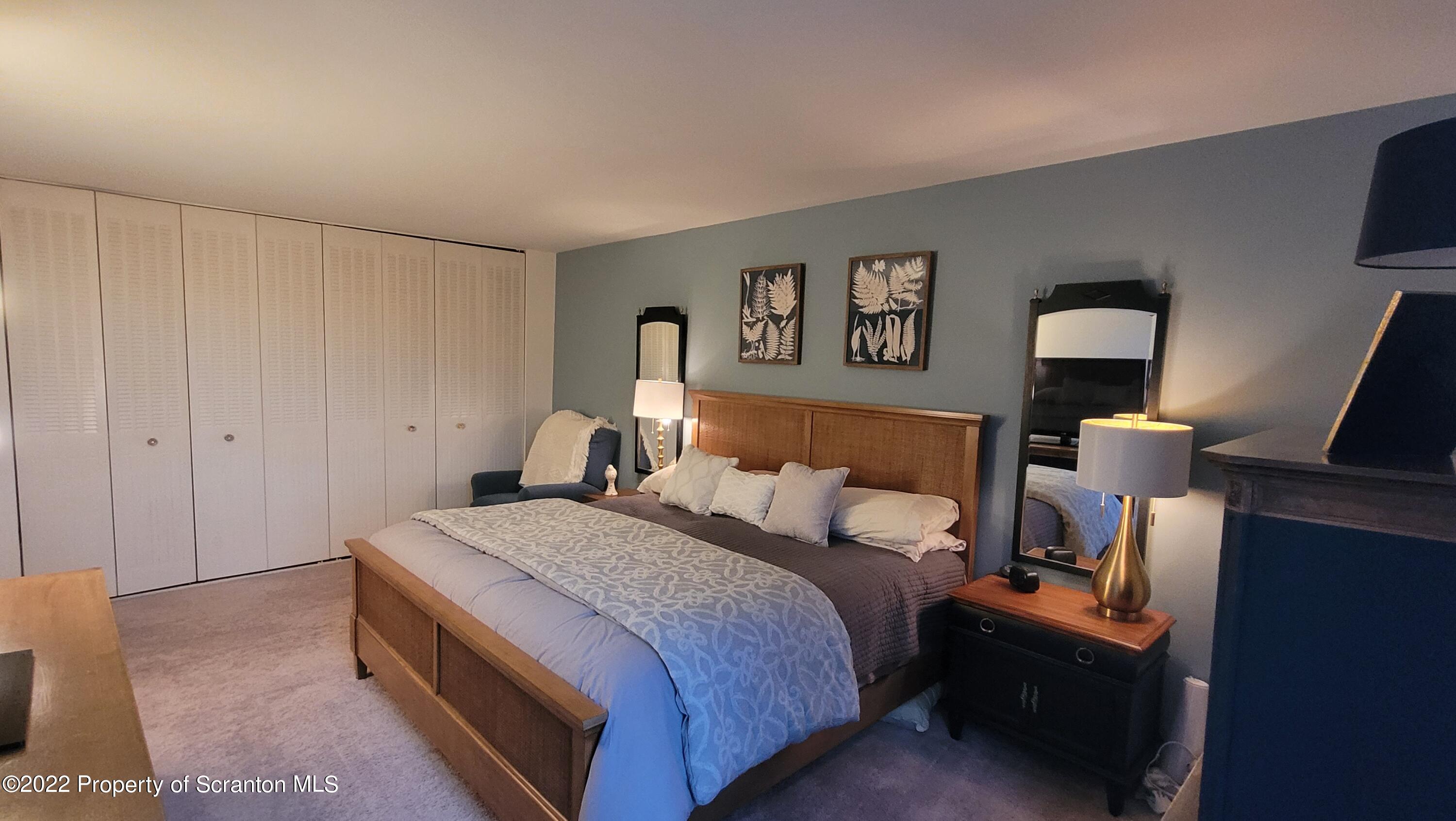 1506 Summit Pointe Scranton, PA 18508 - Photo 20 of 21 a bedroom with a bed and a lamp