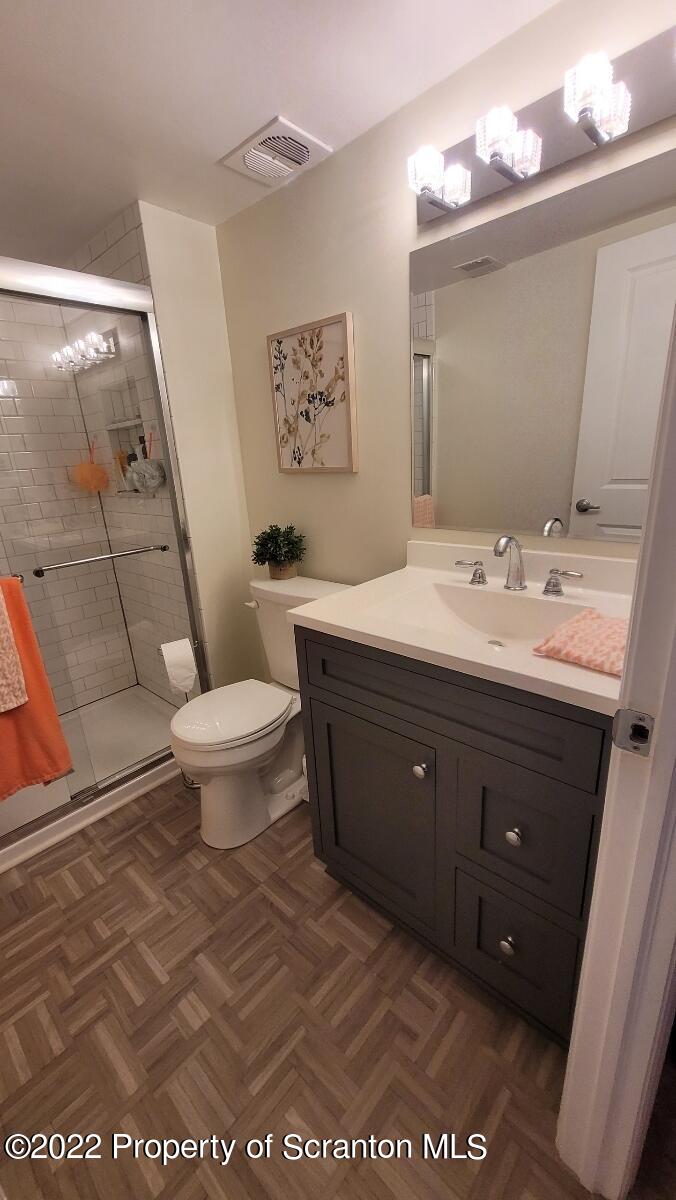 1506 Summit Pointe Scranton, PA 18508 - Photo 21 of 21 a spacious bathroom with a double vanity sink toilet and a mirror