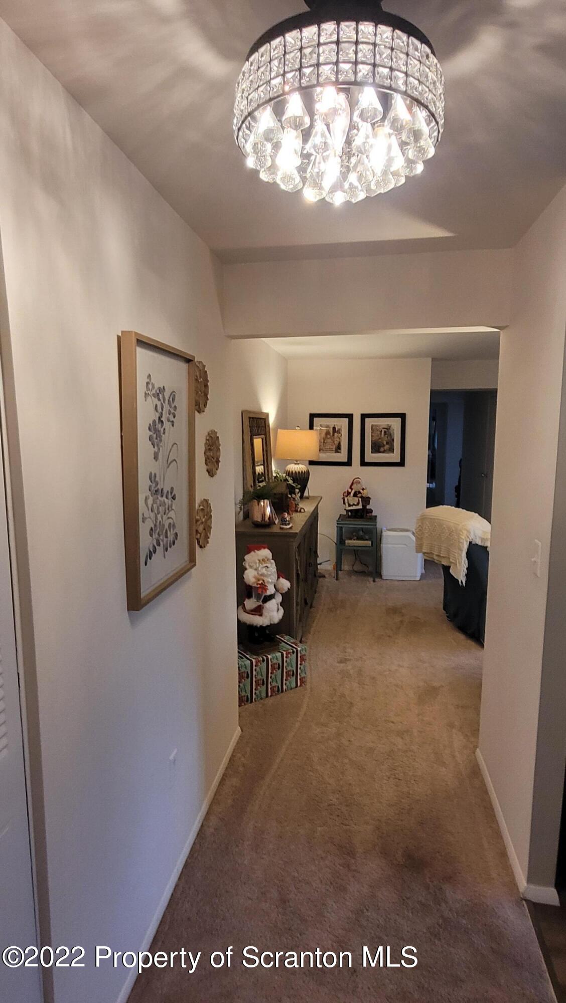 1506 Summit Pointe Scranton, PA 18508 - Photo 3 of 21 a living room with furniture and a chandelier