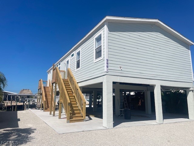 2951 York Road St. James City, FL 33956 - Photo 2 of 17 a view of a house with large windows