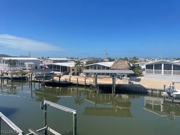 a view of pool table and chairs