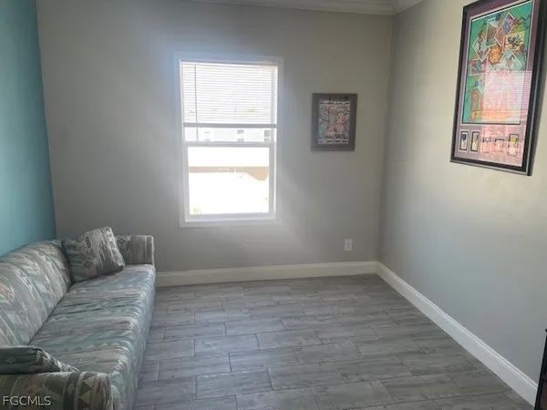 a living room with furniture and a window
