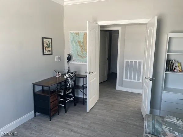 a view of a livingroom with furniture and a window
