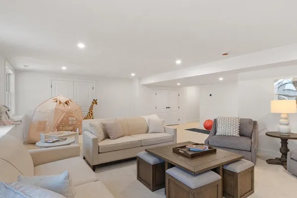 a living room with furniture and a table