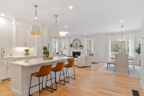 a view of kitchen with furniture and wooden floor