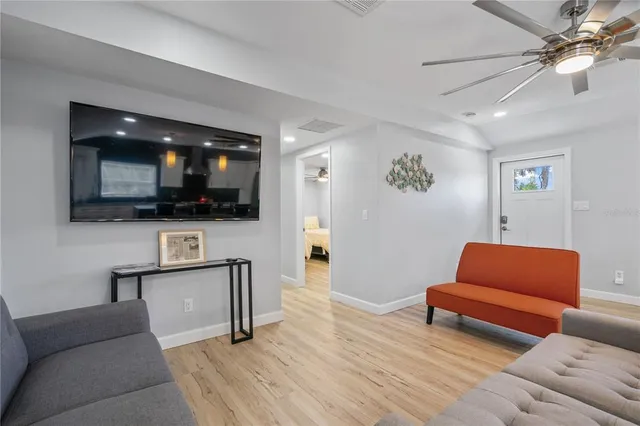 a bedroom with two beds and a window