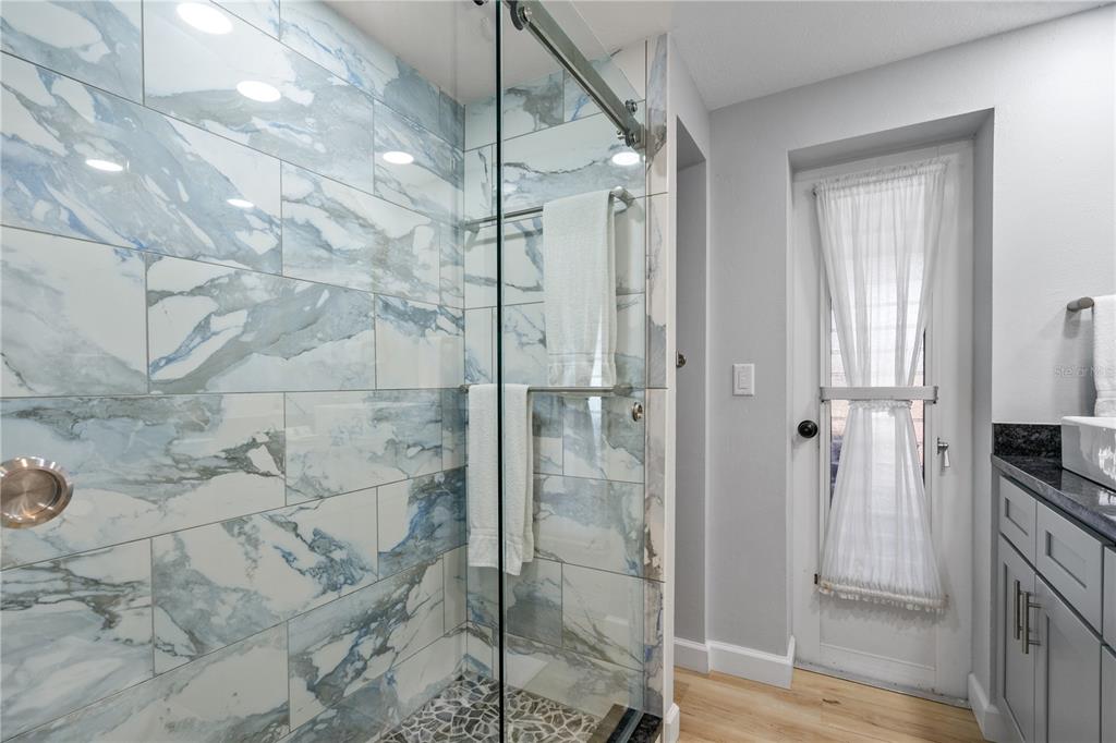 2476 North Beach Road Englewood, FL 34223 - Photo 32 of 58 a bathroom with a shower