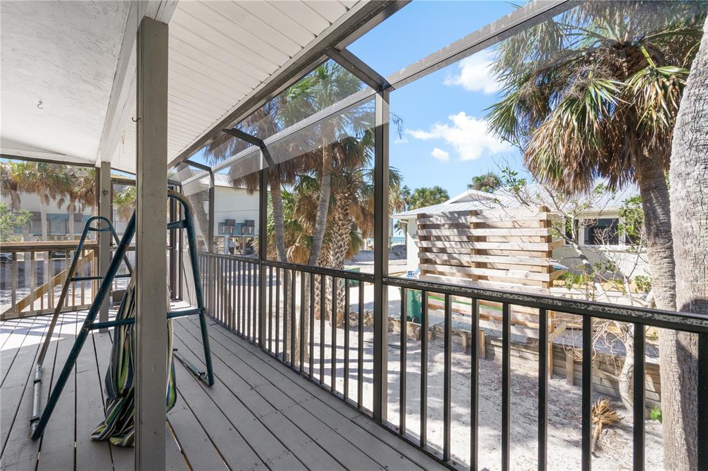 2476 North Beach Road Englewood, FL 34223 - Photo 45 of 58 a view of a balcony with a potted plant