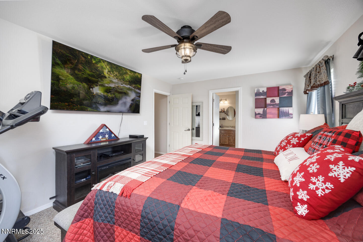 508 Cicada Street Fallon, NV 89406 - Photo 13 of 26 a bedroom with a bed and a flat screen tv