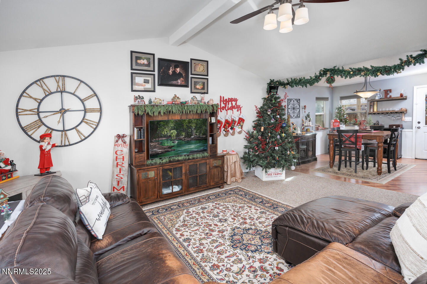 508 Cicada Street Fallon, NV 89406 - Photo 3 of 26 a living room with furniture a flat screen tv and a fireplace