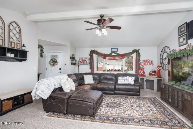 a living room with furniture and a rug