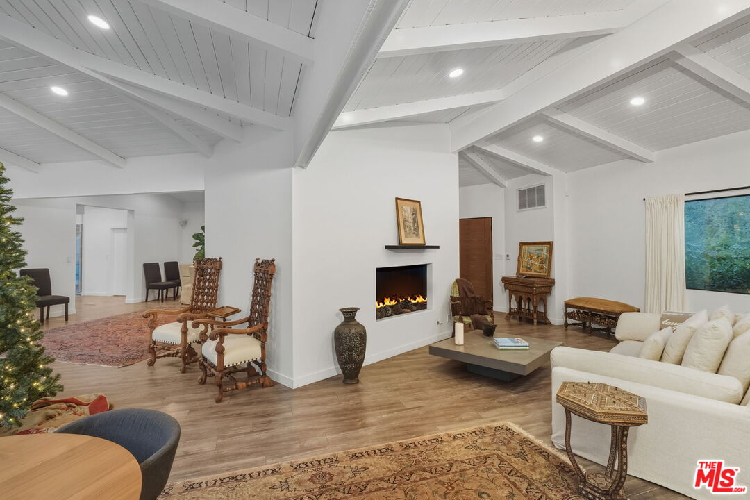 13019 Sky Valley Road Los Angeles, CA 90049 - Photo 14 of 39 a living room with fireplace furniture and a fireplace