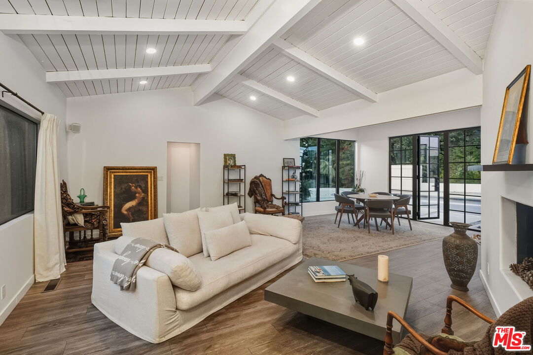 13019 Sky Valley Road Los Angeles, CA 90049 - Photo 15 of 39 a living room with furniture and a flat screen tv