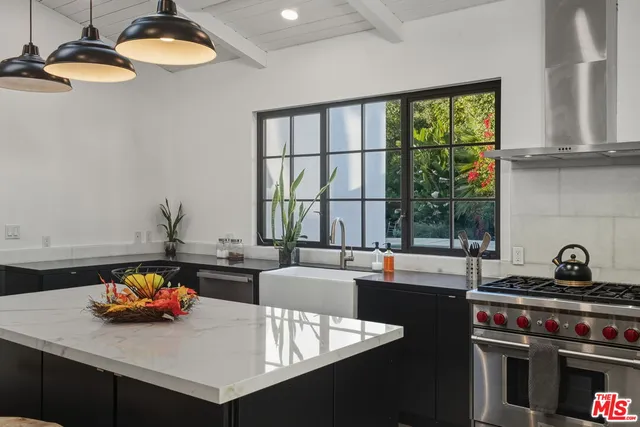 a spacious bathroom with a double vanity sink and a large mirror