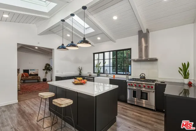 a kitchen with a sink and refrigerator