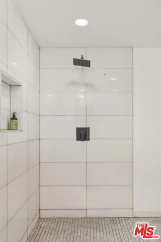 a bathroom with a bathtub and a sink