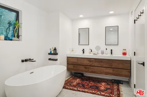 a view of swimming pool and dinning table and chairs