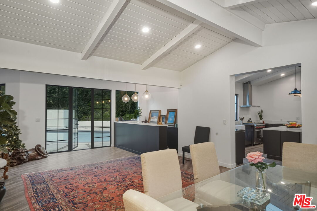 13019 Sky Valley Road Los Angeles, CA 90049 - Photo 7 of 39 a living room with furniture and a large window