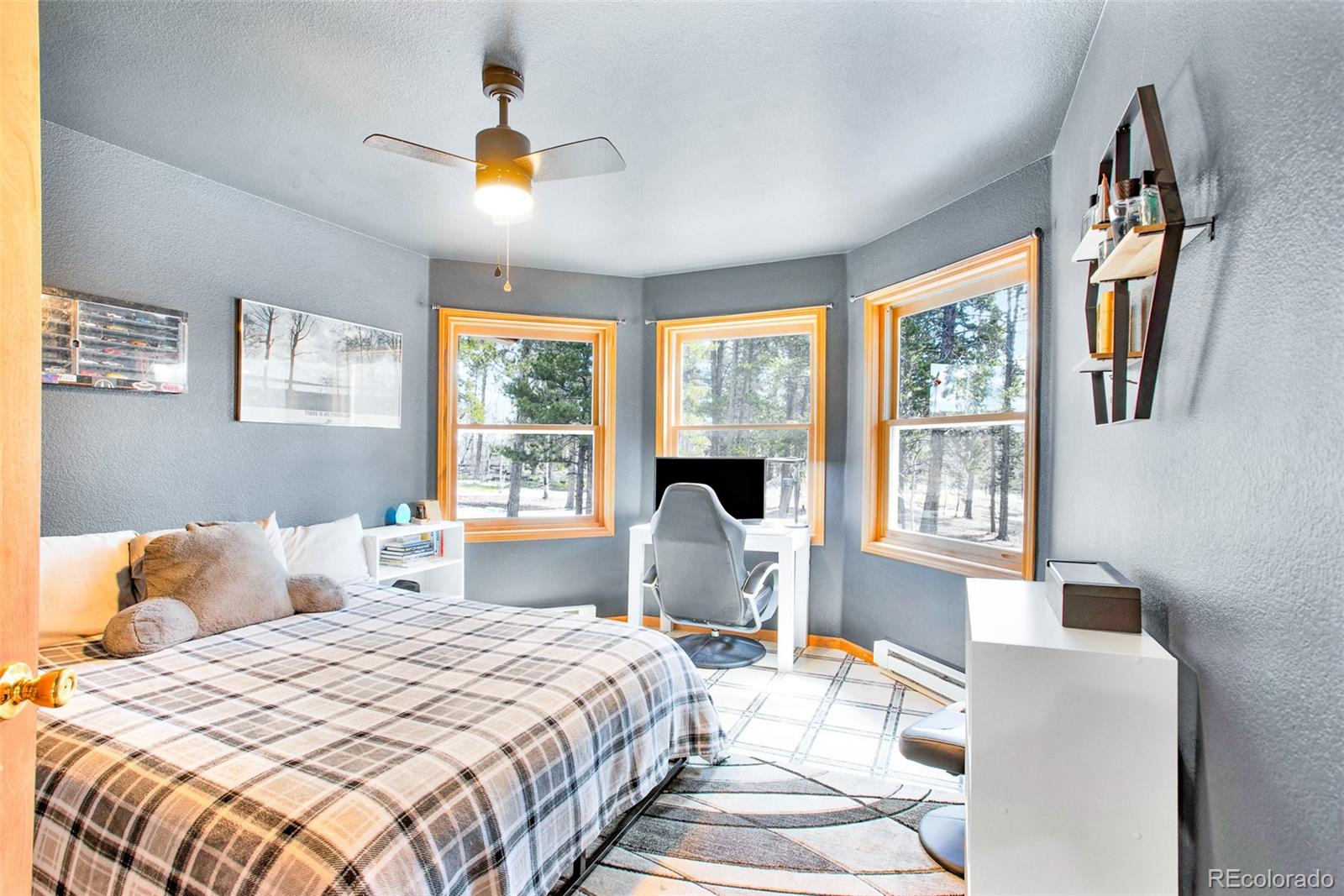 757 Thompson Park Road Fairplay, CO 80440 - Photo 21 of 49 a bedroom with a bed and a window