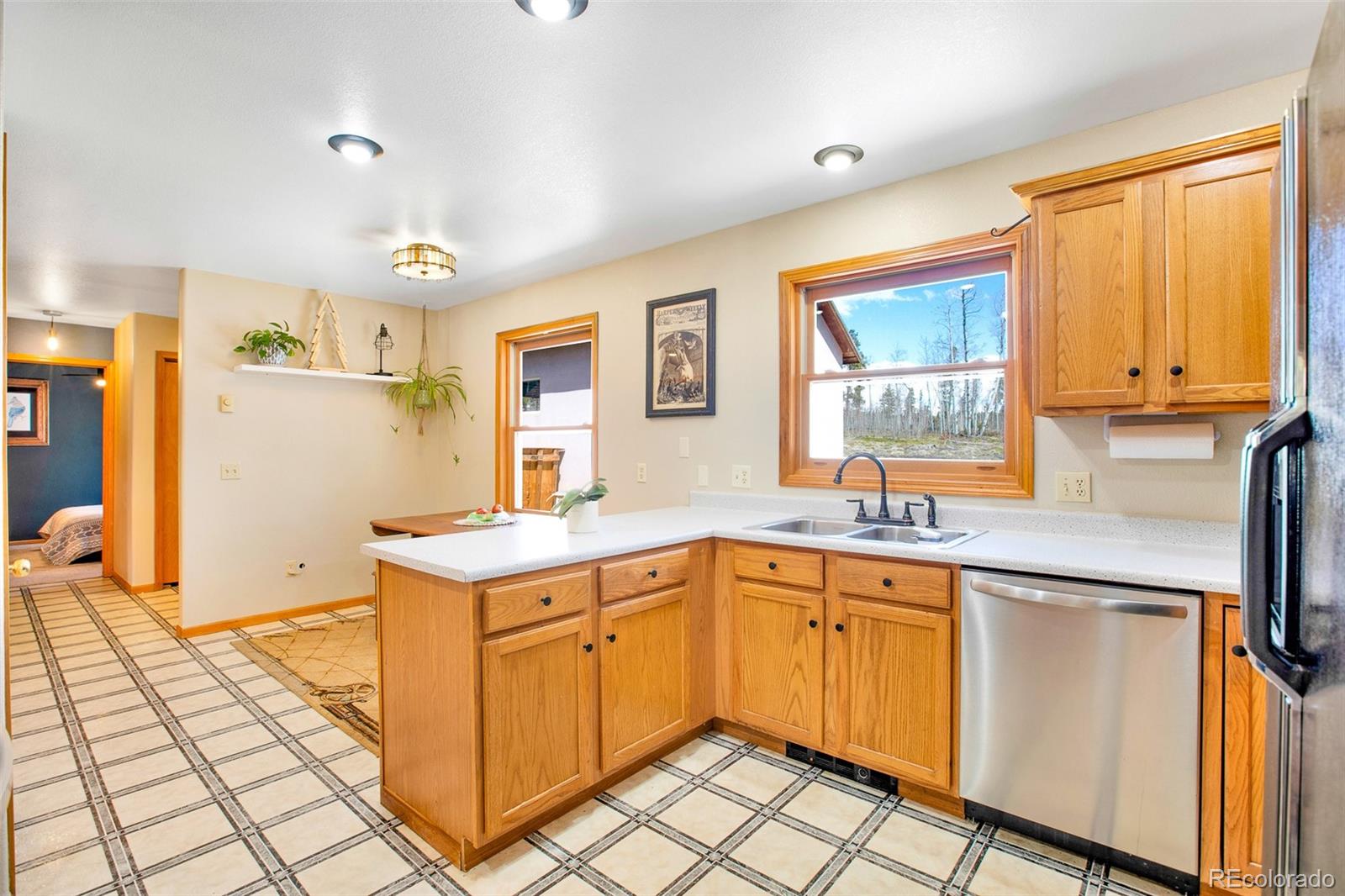 757 Thompson Park Road Fairplay, CO 80440 - Photo 30 of 49 a kitchen with a sink window and cabinets