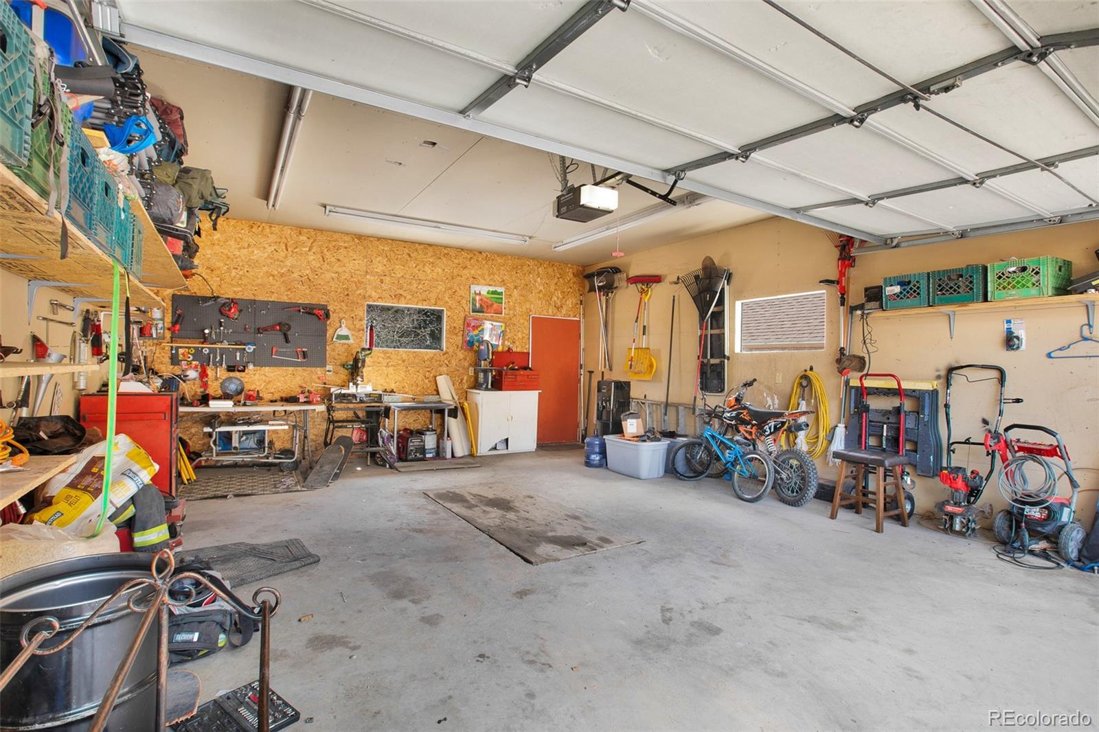 757 Thompson Park Road Fairplay, CO 80440 - Photo 40 of 49 a view of a garage with a bike and a car
