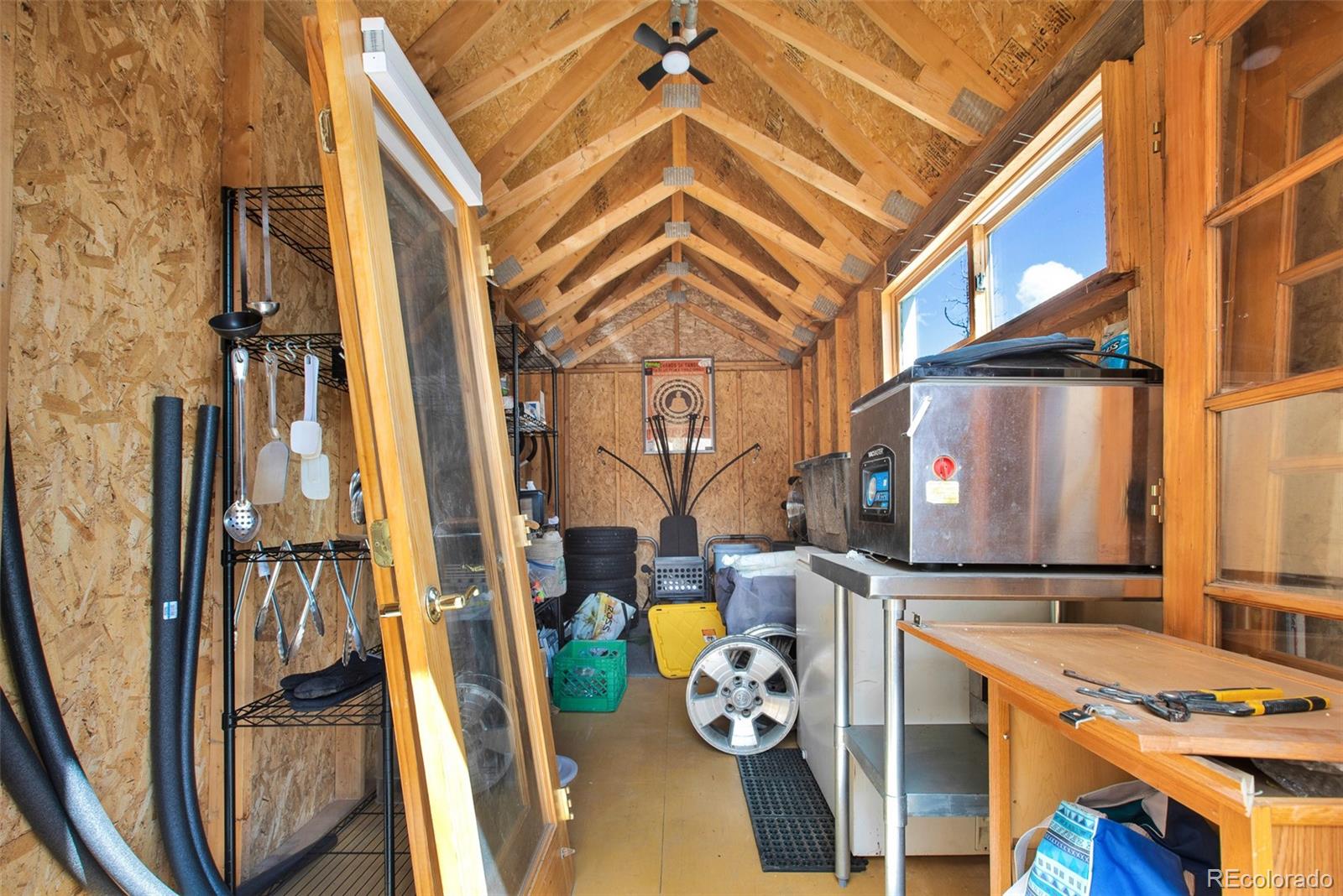 757 Thompson Park Road Fairplay, CO 80440 - Photo 42 of 49 a view of a living room with furniture and floor to ceiling window