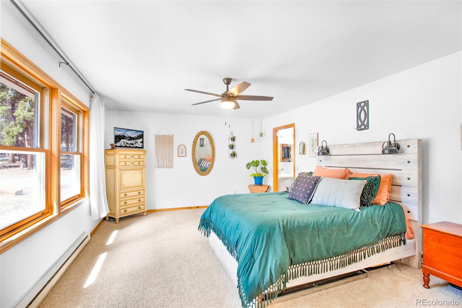 757 Thompson Park Road Fairplay, CO 80440 - Photo 8 of 49 a bedroom with a bed and a large window