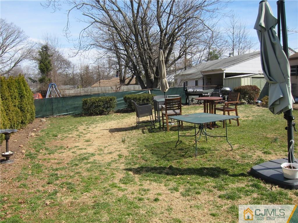 30 Matson Road Edison, NJ 08817 - Photo 14 of 15 a view of a house with backyard and sitting area