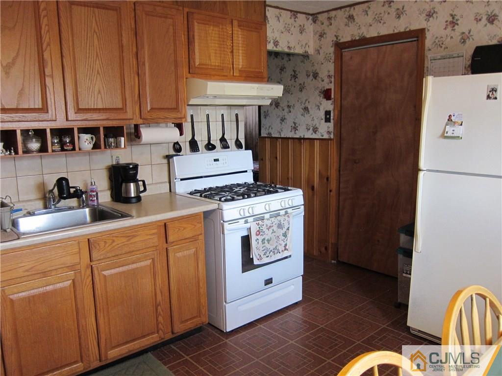 30 Matson Road Edison, NJ 08817 - Photo 3 of 15 a kitchen with stainless steel appliances granite countertop a refrigerator a stove and a refrigerator