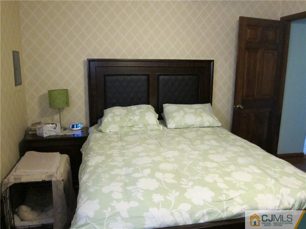 30 Matson Road Edison, NJ 08817 - Photo 8 of 15 a bed room with a bed and a chair