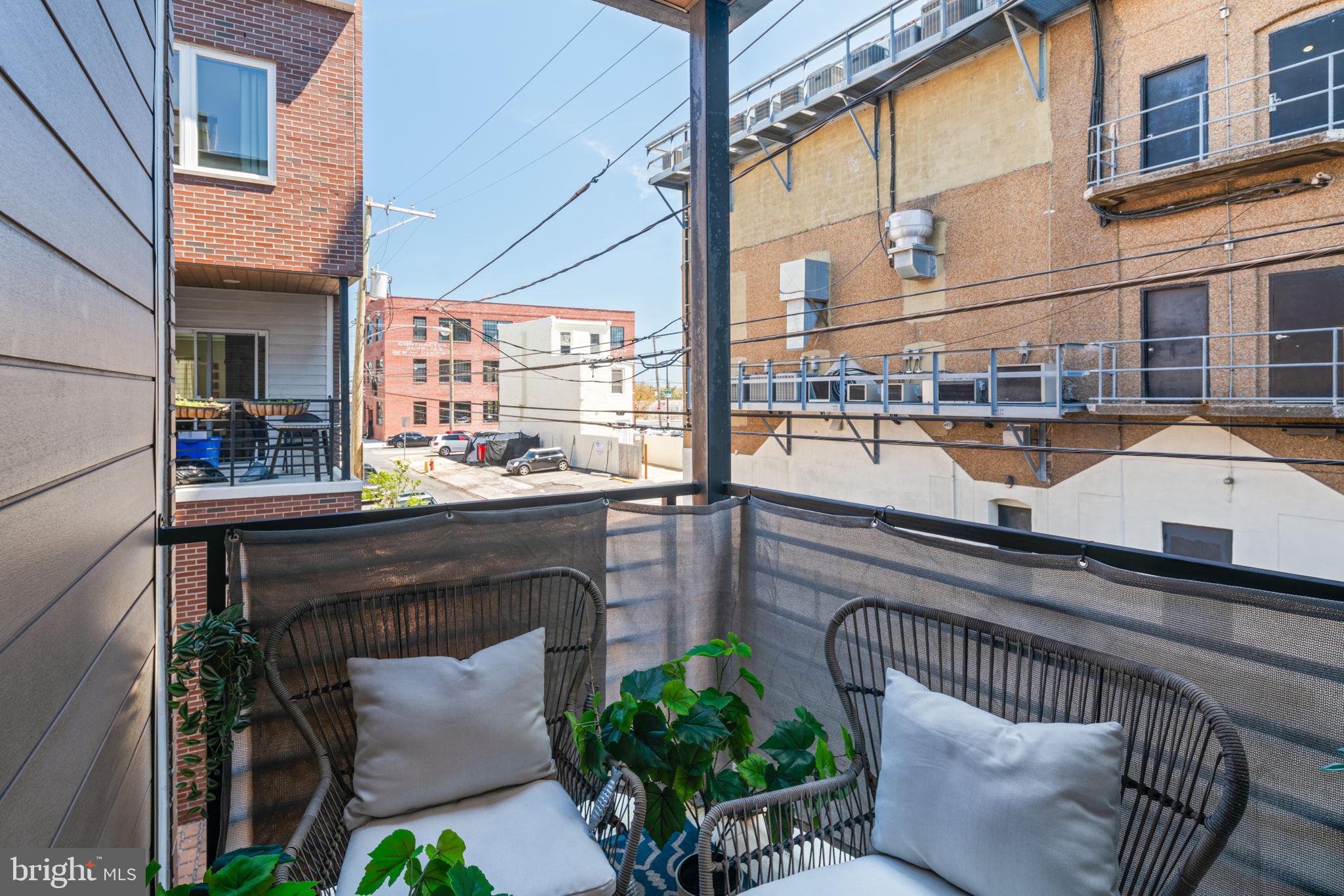 159 East Allen Street, Unit 1 Philadelphia, PA 19125 - Photo 43 of 45 a balcony with couple of chairs and a couch