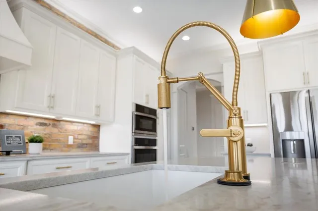 view of hall with wooden floor and cabinet