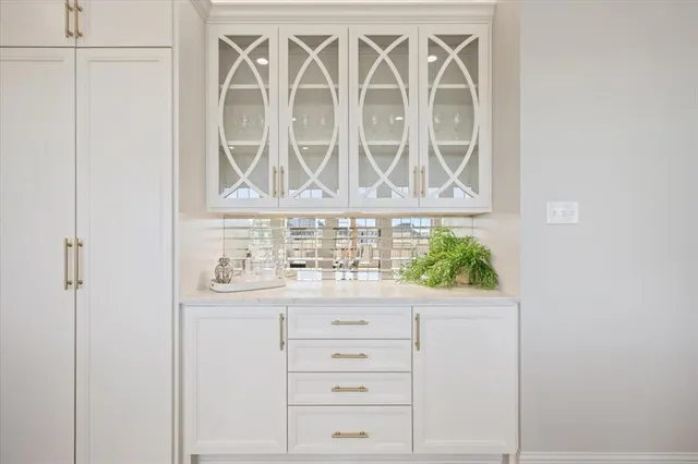 a lobby with furniture and a floor to ceiling window