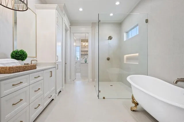 a white bath tub sitting in a bathroom