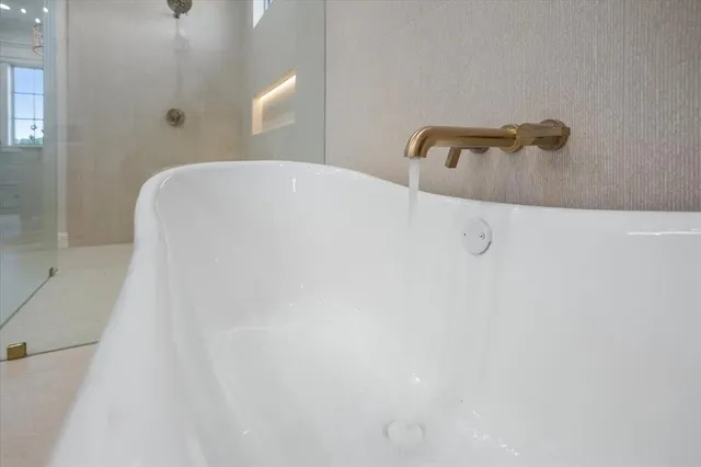 a kitchen with a refrigerator and window