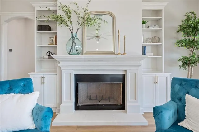 a living room with furniture and a fireplace