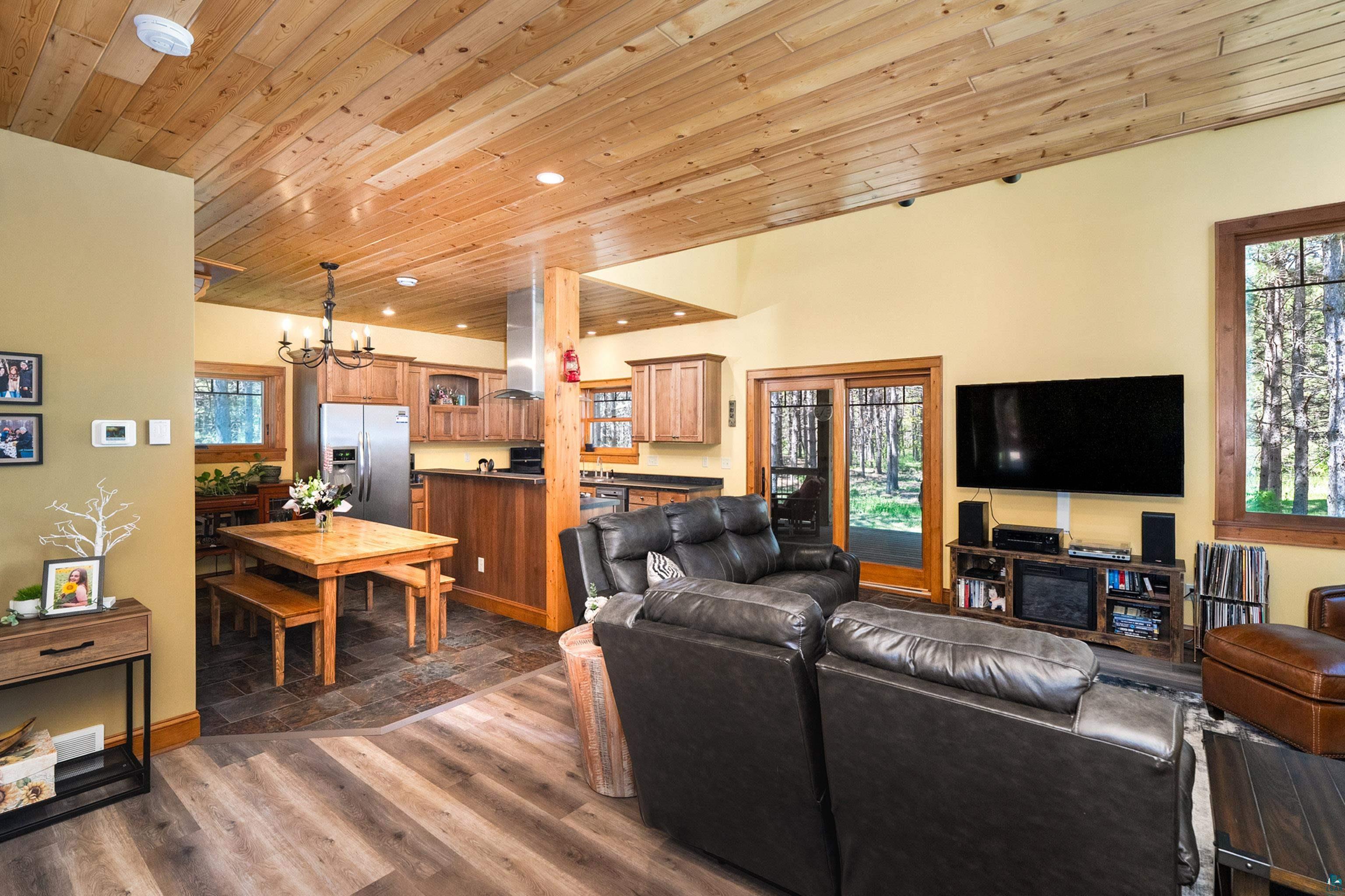 75 East Stark Road Esko, MN 55733 - Photo 18 of 87 Open-concept living area featuring a vaulted wood-finish ceiling with recessed lighting