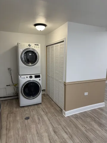 a view of a kitchen with a washer and dryer