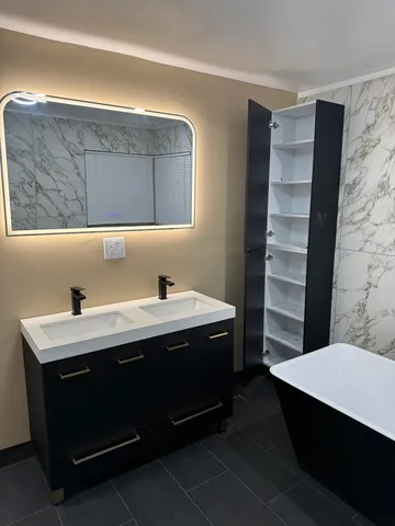 a bathroom with a sink and a mirror