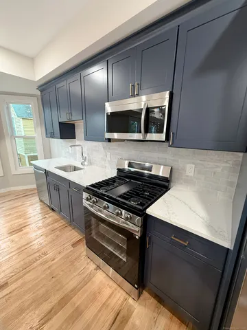 a kitchen with a stove and a microwave