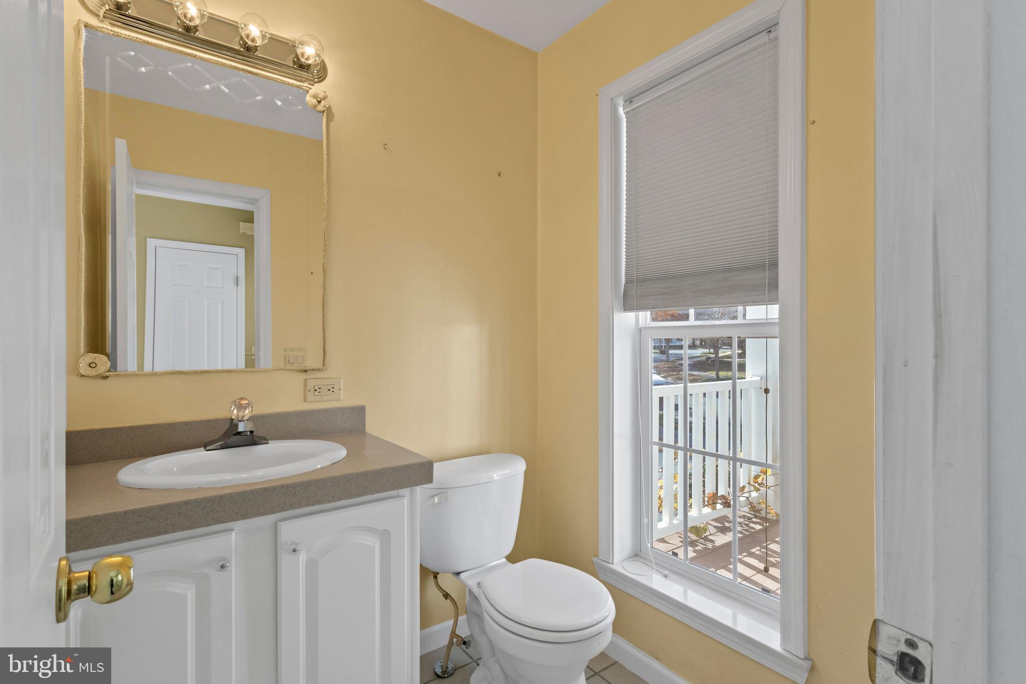 32530 Approach Way, Unit 3252 Millsboro, DE 19966 - Photo 17 of 54 a bathroom with a toilet a sink and a mirror