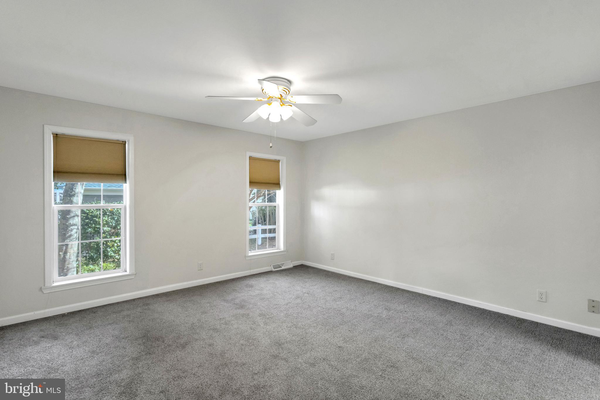 32530 Approach Way, Unit 3252 Millsboro, DE 19966 - Photo 19 of 54 a view of an empty room with a window
