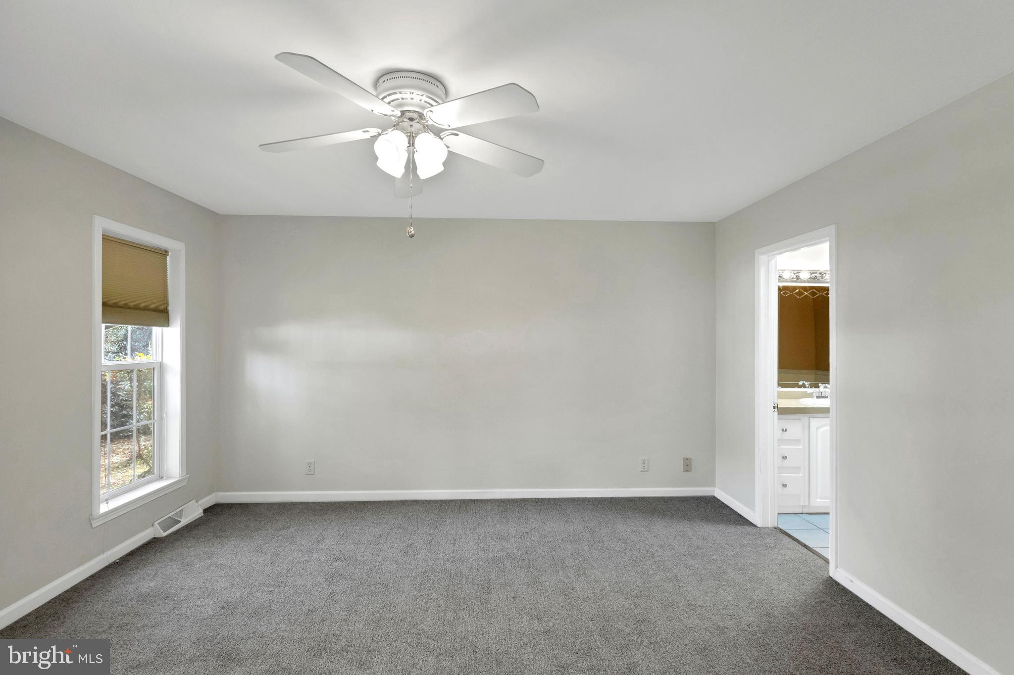 32530 Approach Way, Unit 3252 Millsboro, DE 19966 - Photo 20 of 54 a view of an empty room with a window