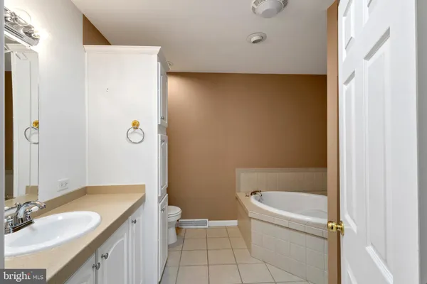 a bathroom with a sink and shower