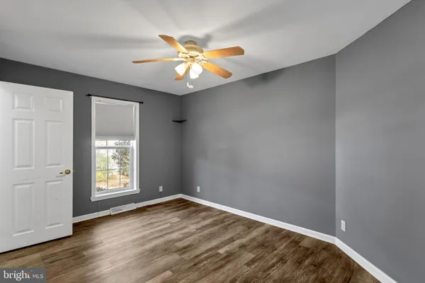 an empty room with fan