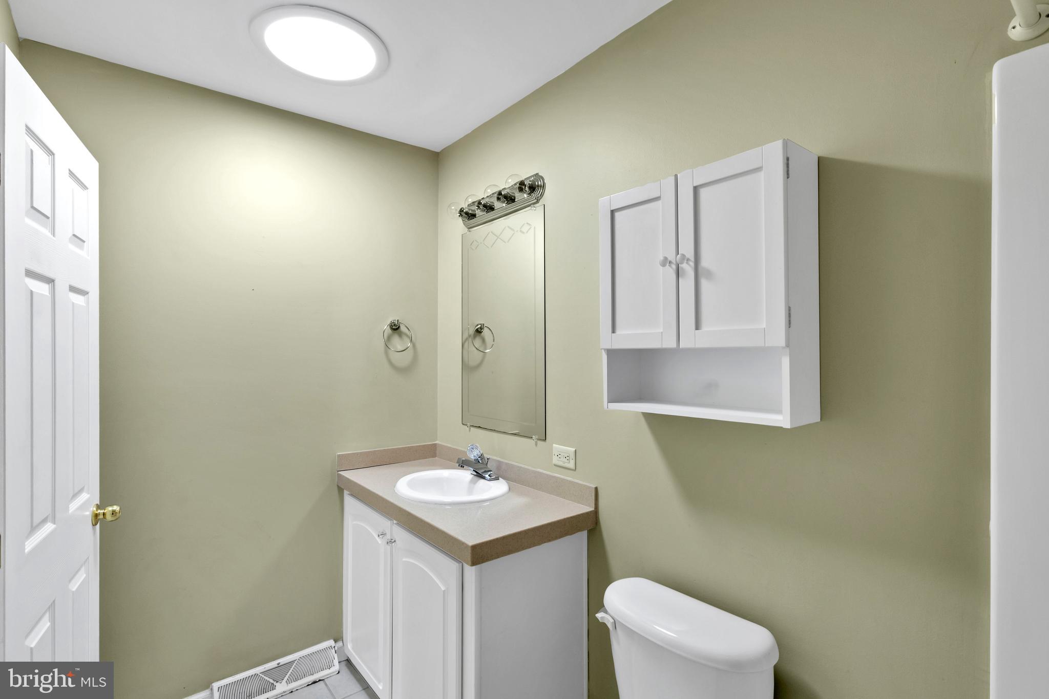 32530 Approach Way, Unit 3252 Millsboro, DE 19966 - Photo 29 of 54 a bathroom with a sink toilet and mirror